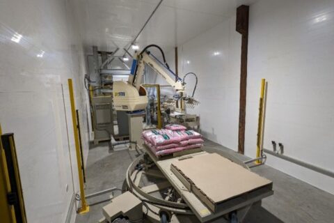 Automated Robot Carriers And Robotic Arm In Smart Distribution Warehouse