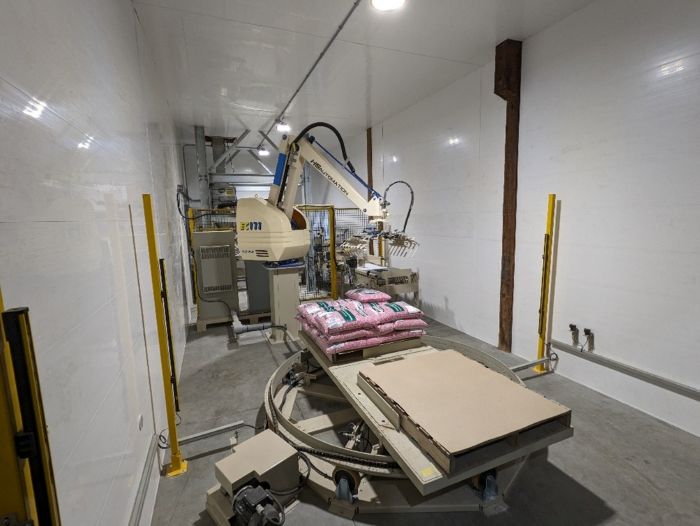 Automated Robot Carriers And Robotic Arm In Smart Distribution Warehouse